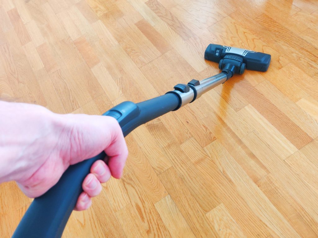 Image of vacuuming parquet flooring